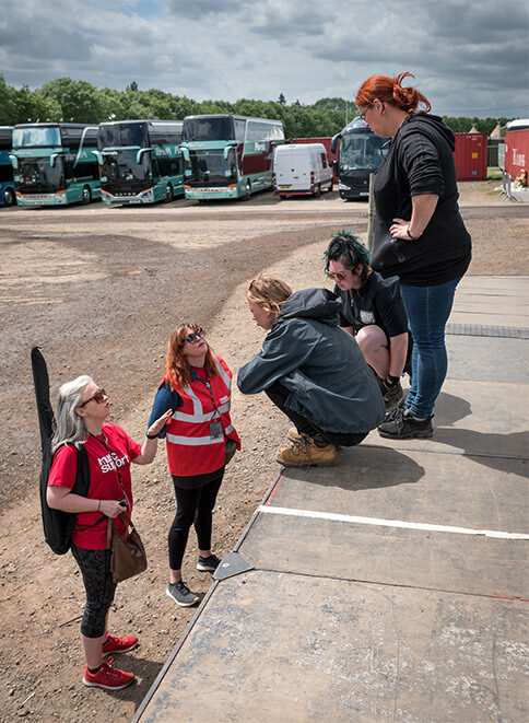 Music support team members chatting to crew at Download festival.